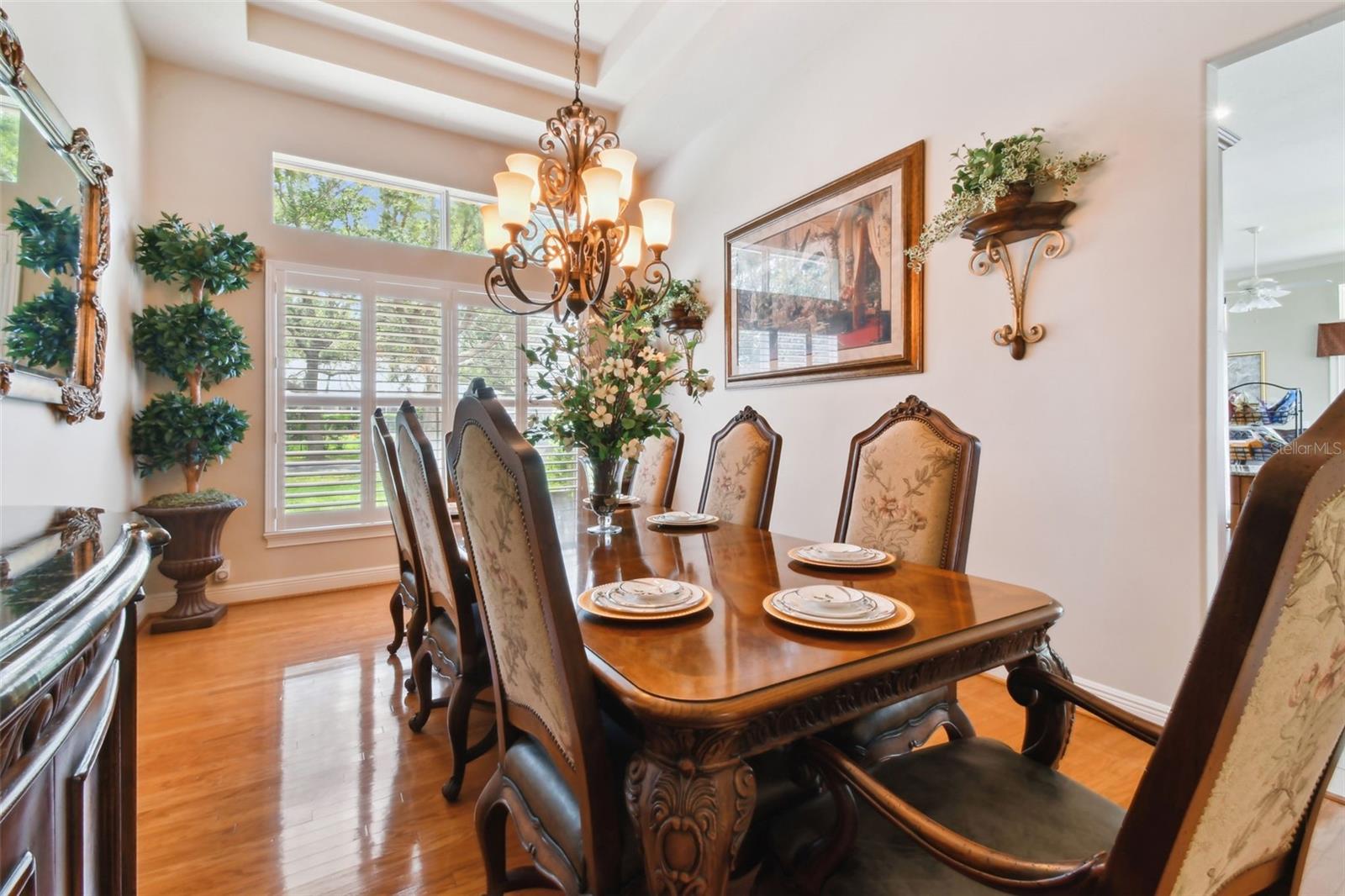 Dining room adjacent to the kitchen with hardwood floors.