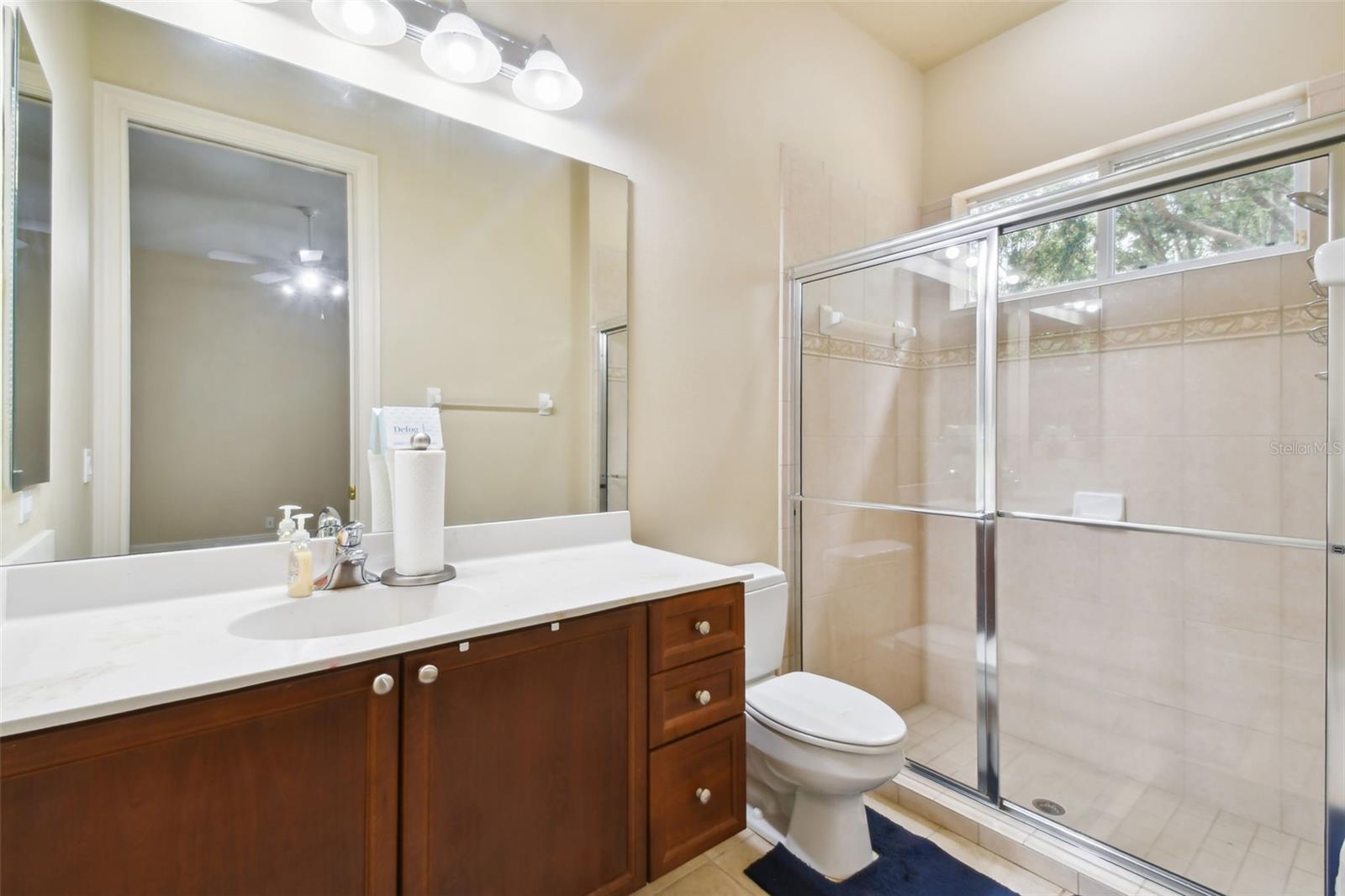 Bedroom 3 en-suite with vanity and walk-in shower.