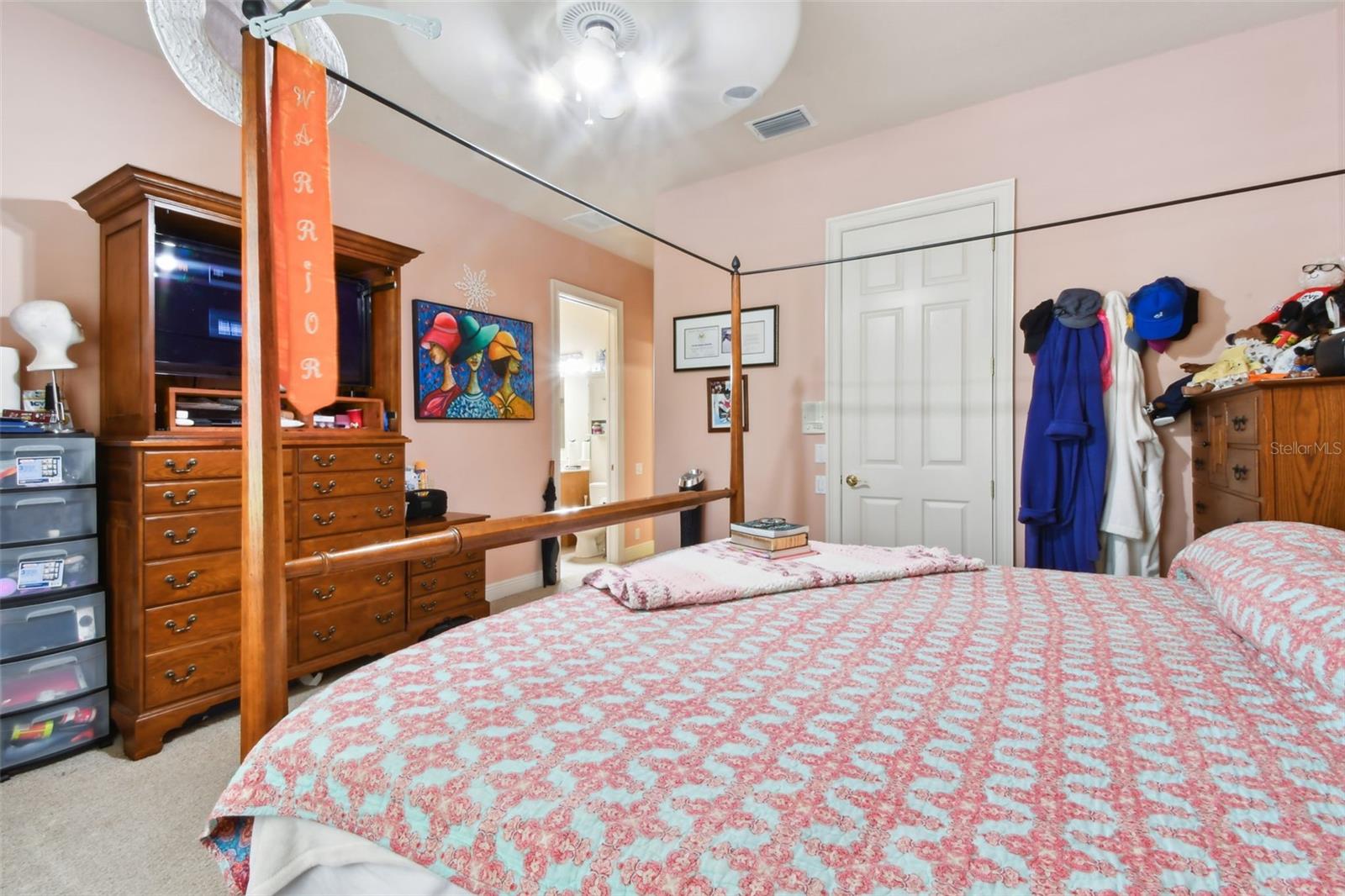 Bedroom 4 with en-suite and built-in closet.  Views out towards the Trails.