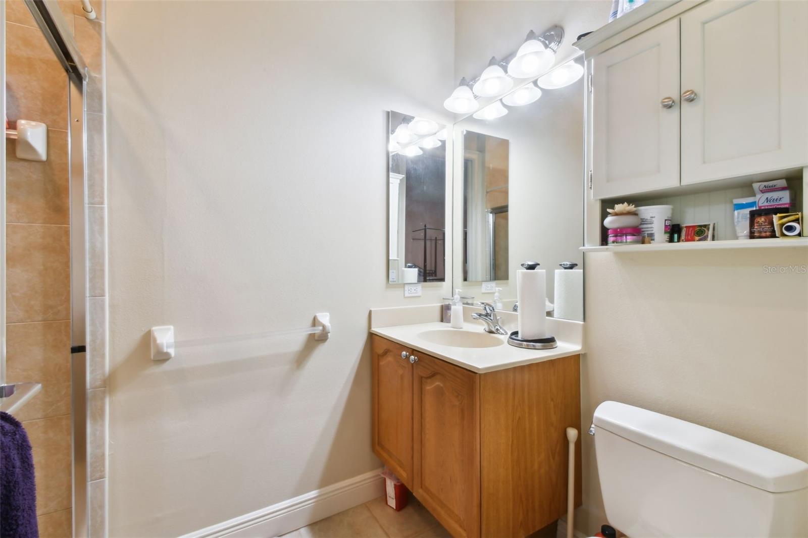 Bedroom 4 en-suite with vanity and walk-in shower.