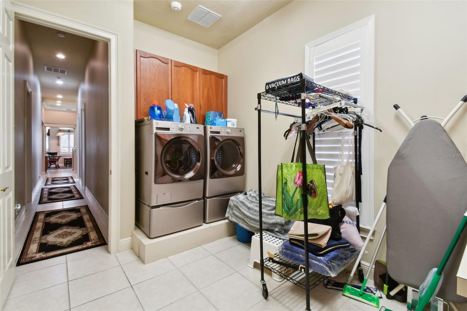 Laundry room at the end of the hallway. Access from here to the 4-car garage.