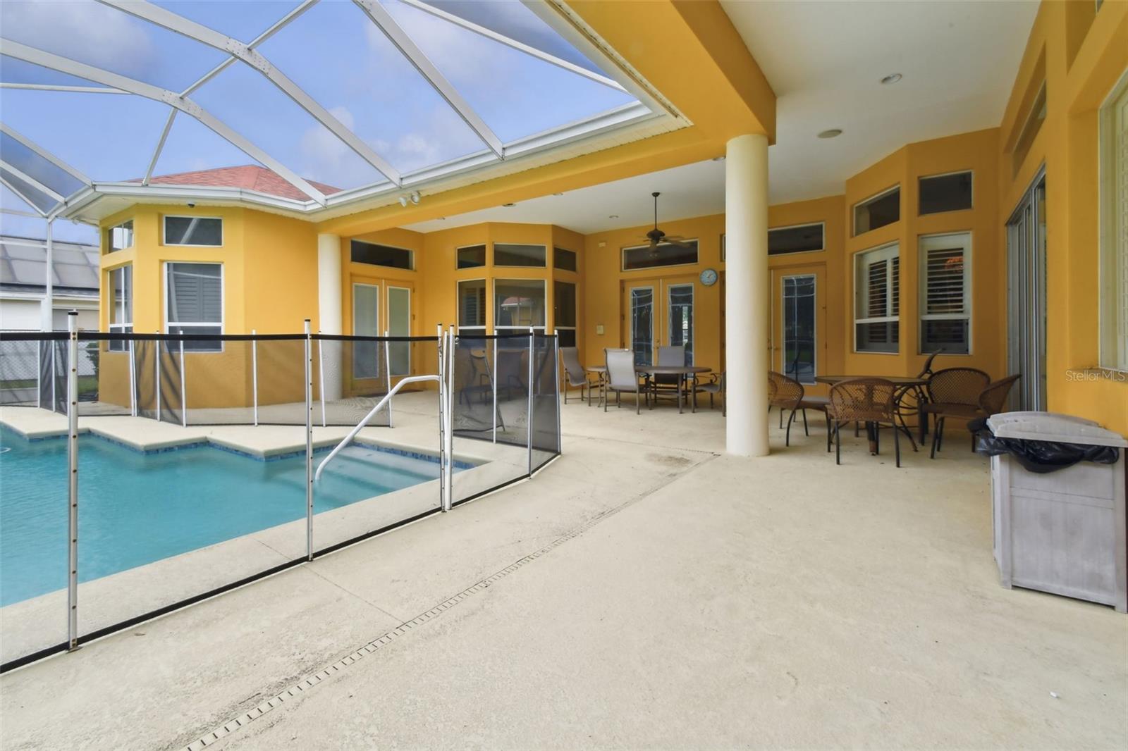 Screened pool and outdoor space for entertaining.