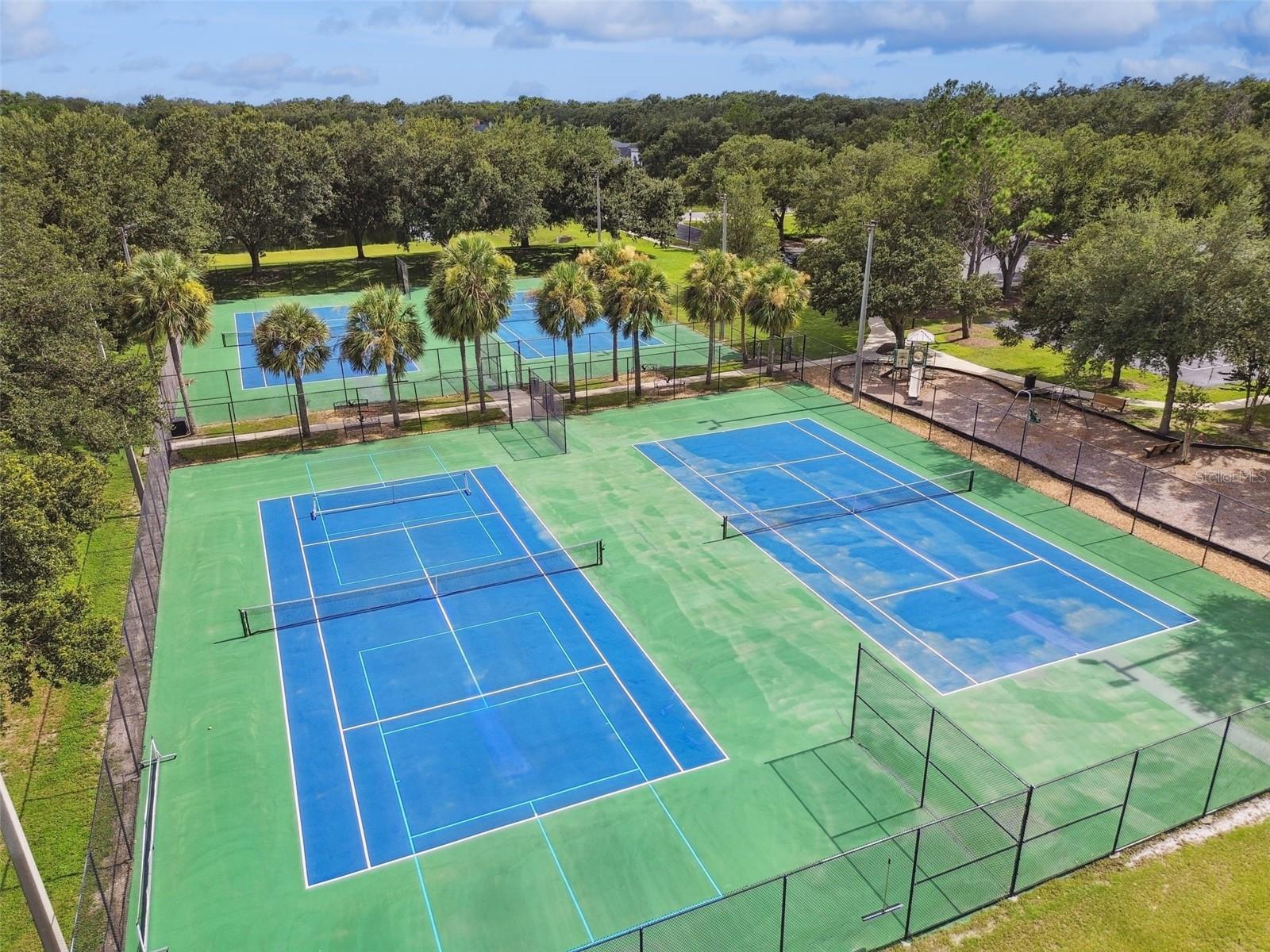 Community tennis courts at the end of the street.