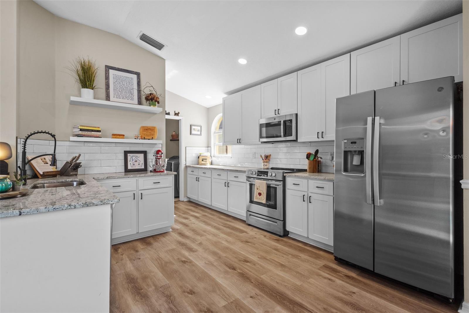 PLENTY OF CABINET SPACE WITH MODERN OPEN SHELVING