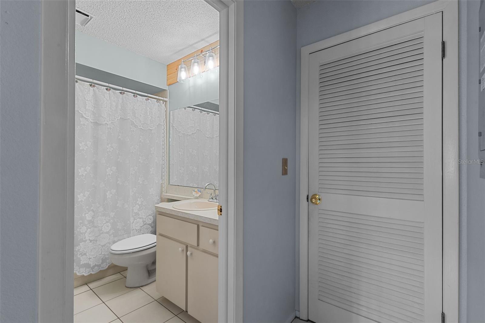 Bathroom 2 - just off bedroom 2 at front of home adjacent to kitchen/dining
