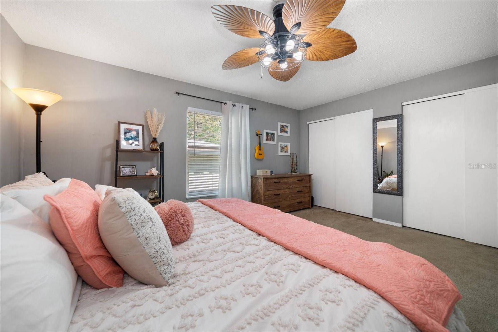 The expansive primary bedroom spans the width of the condo, providing the owner plenty of space.