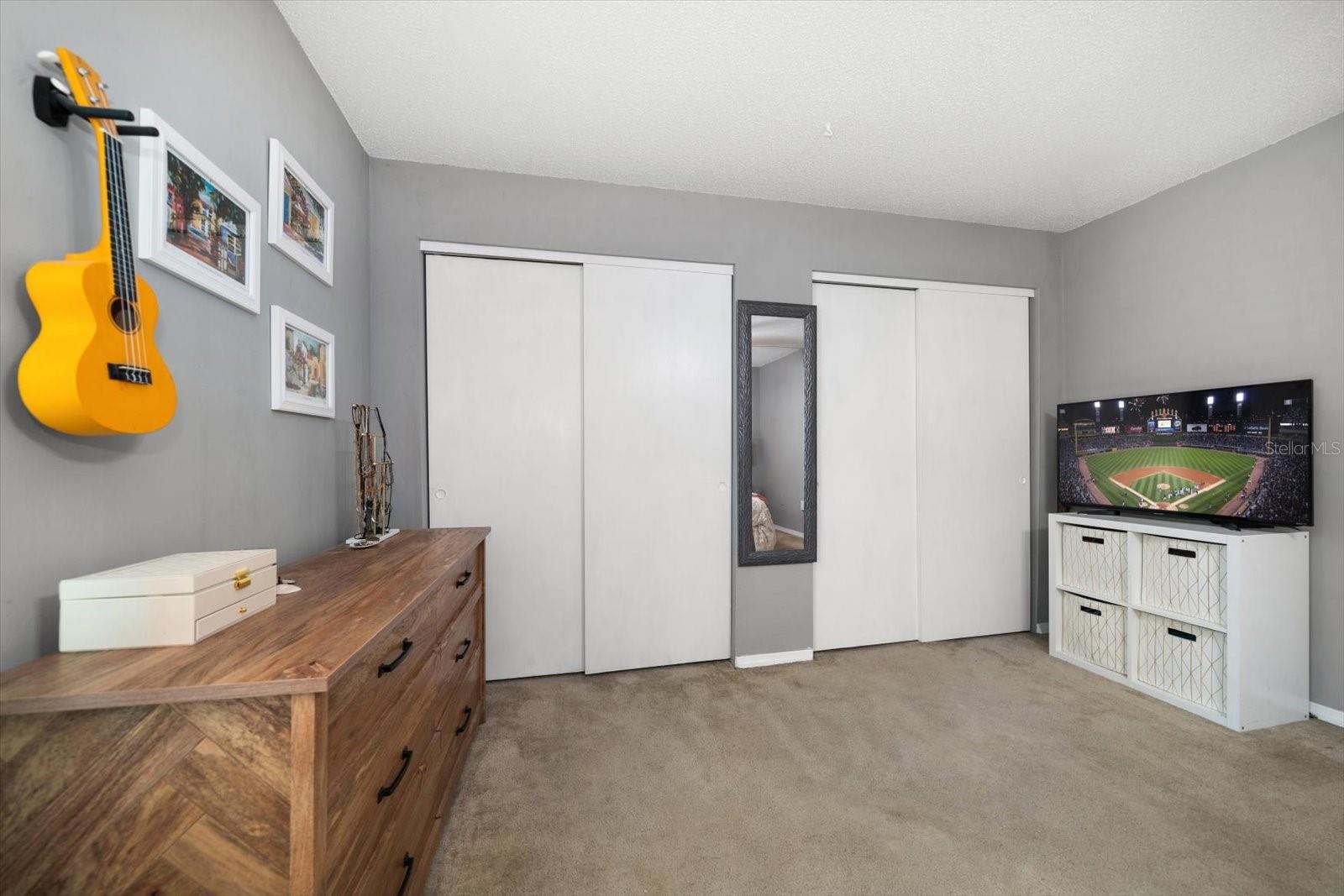 Wall to wall closet space to store all your belongings in your primary bedroom.