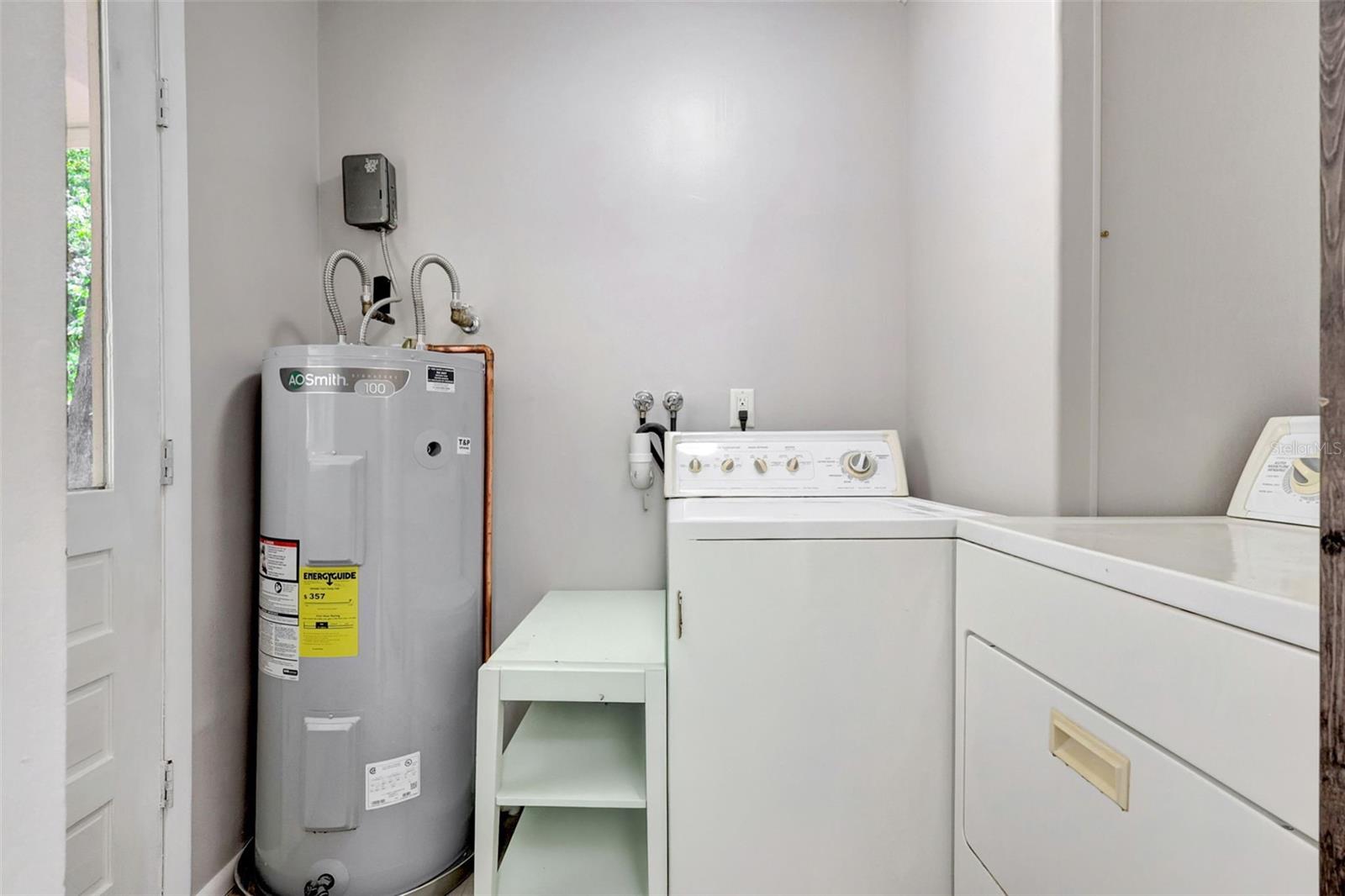 Mud Room/Laundry Room. Note 2024 water heater with timer, installed up to code!