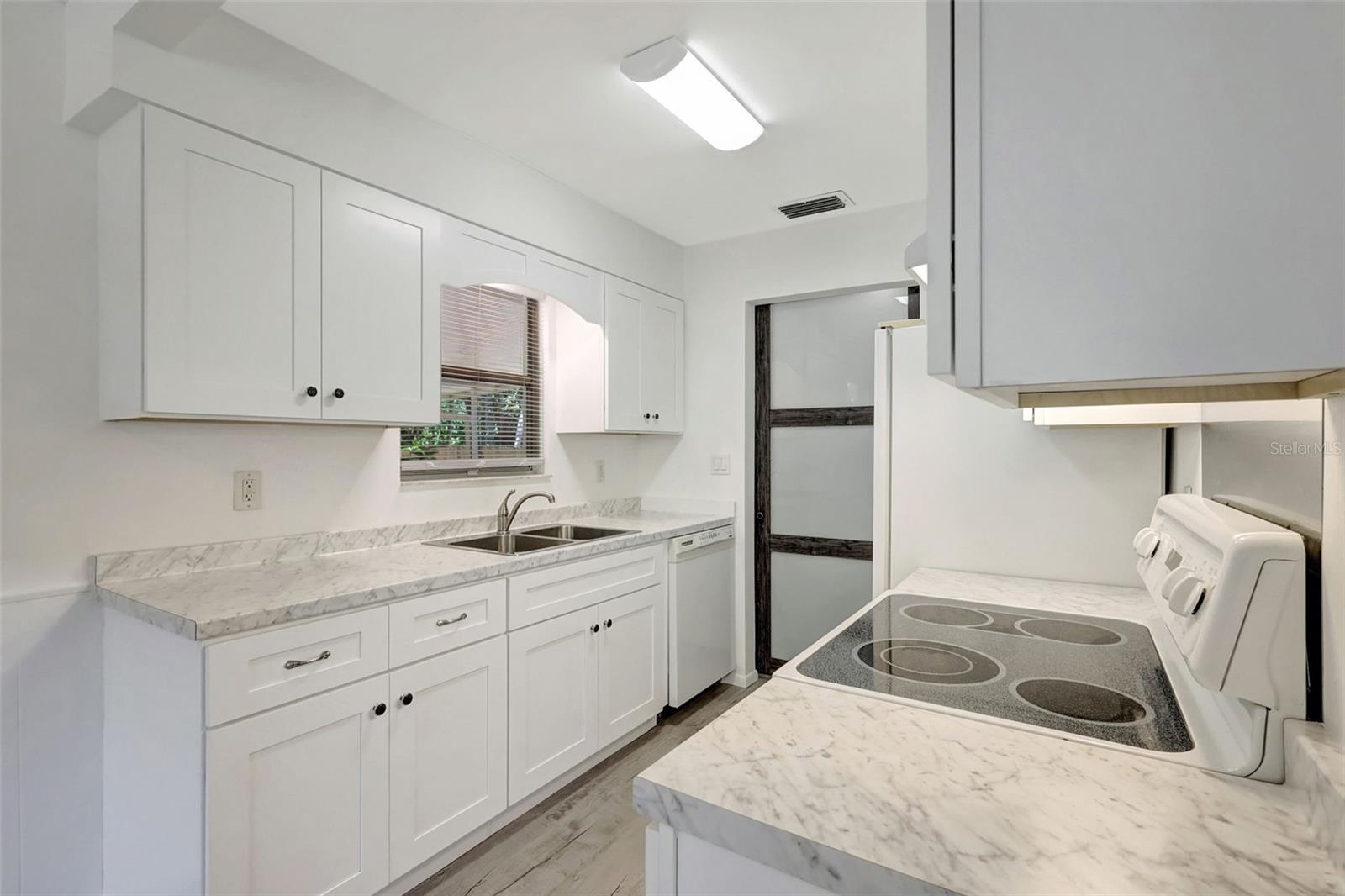 The lower cabinets have roll out drawers!, Note the Dishwasher!
