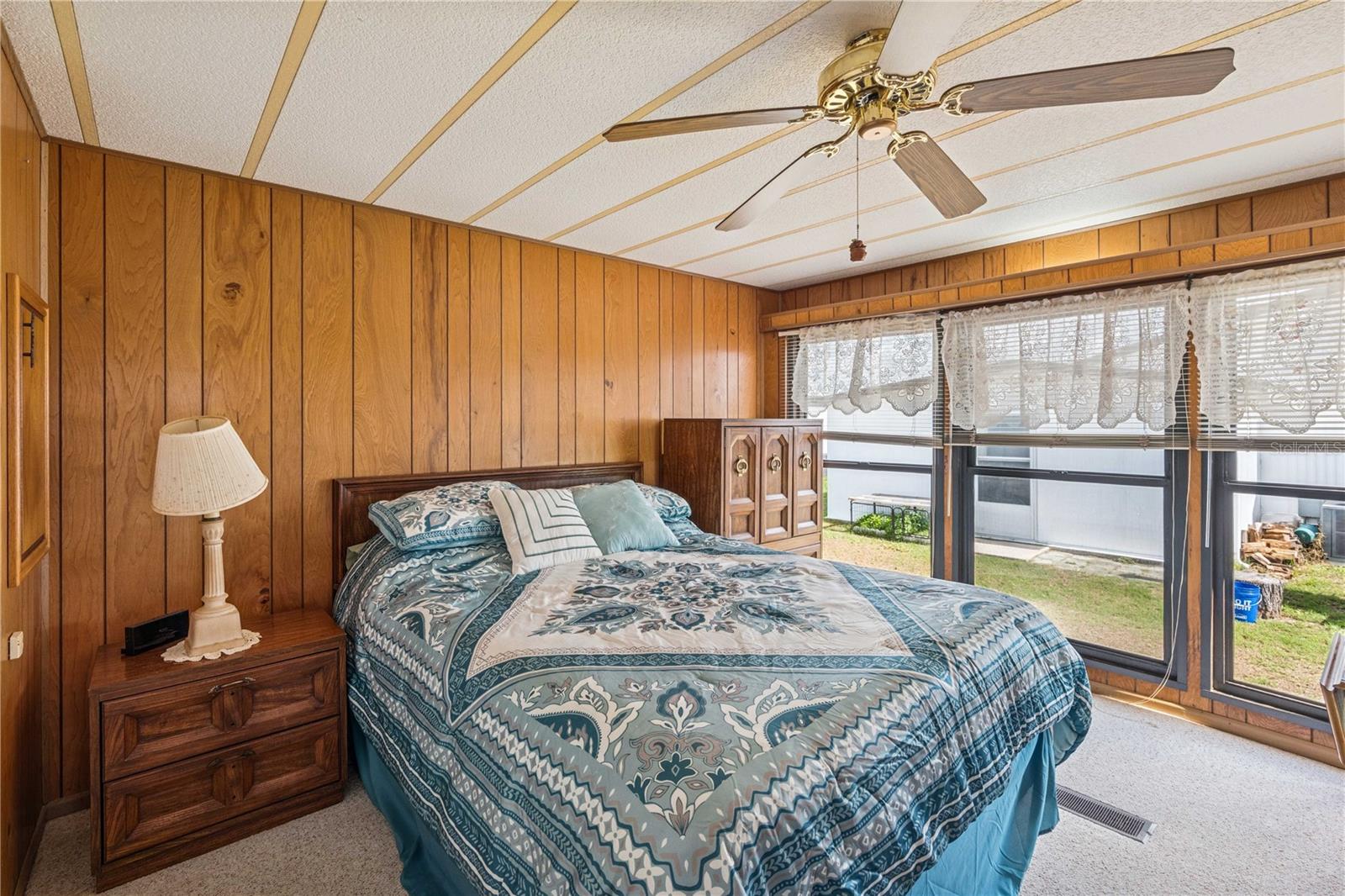 Primary bedroom located in the back of home.