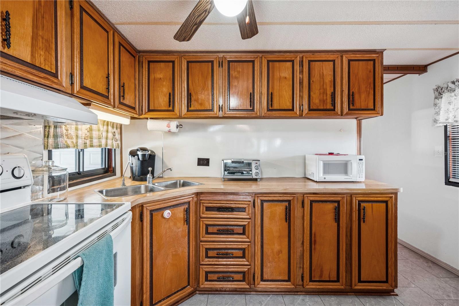 Nice kitchen with wood cabinets.