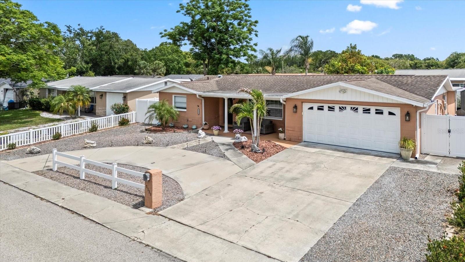 Front view with large driveway