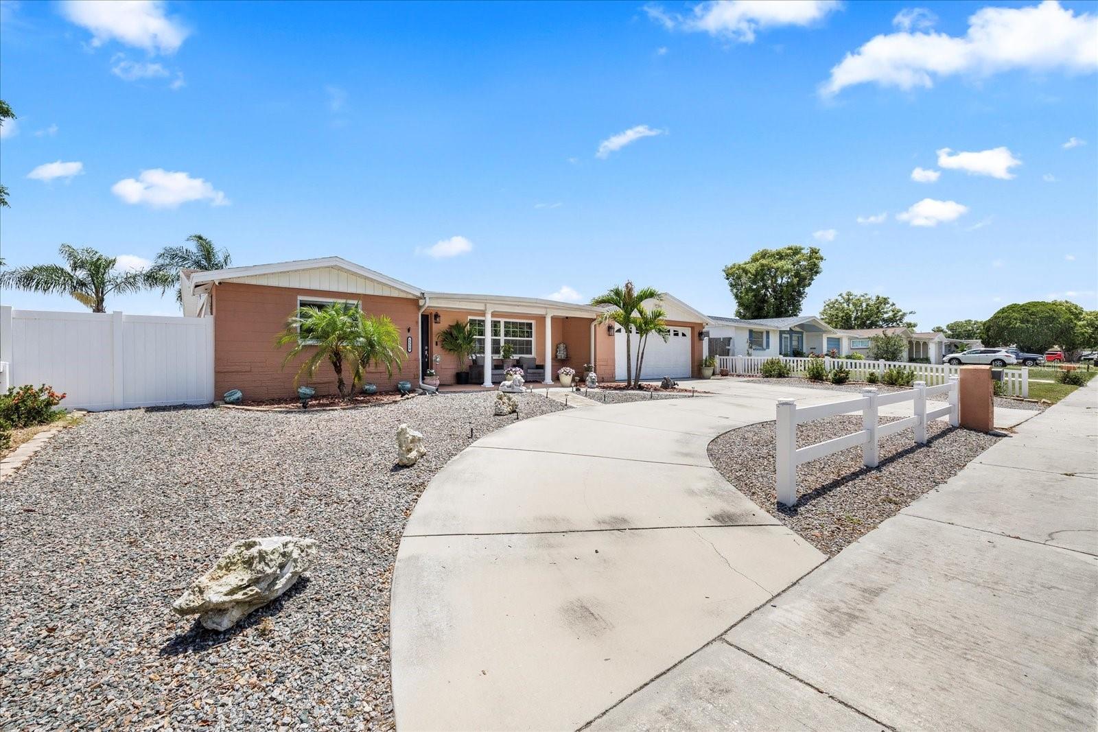 Curved drive way plus parking in front of garage
