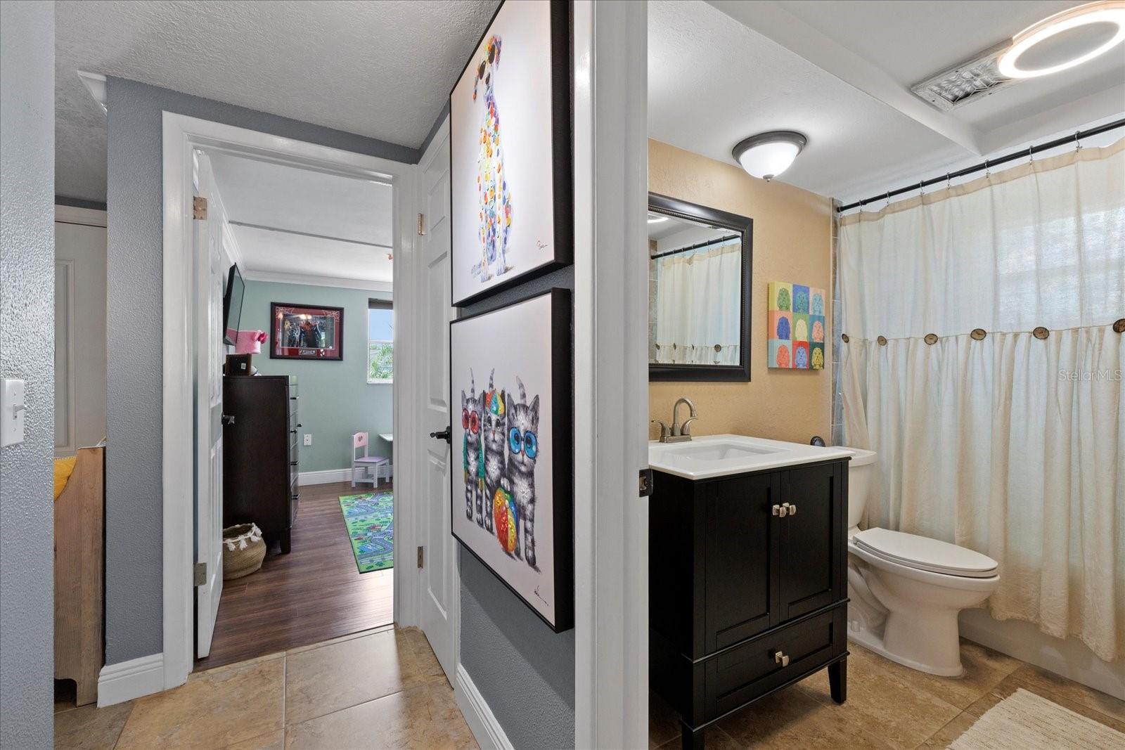 Hallway to guest bathroom and bedroom