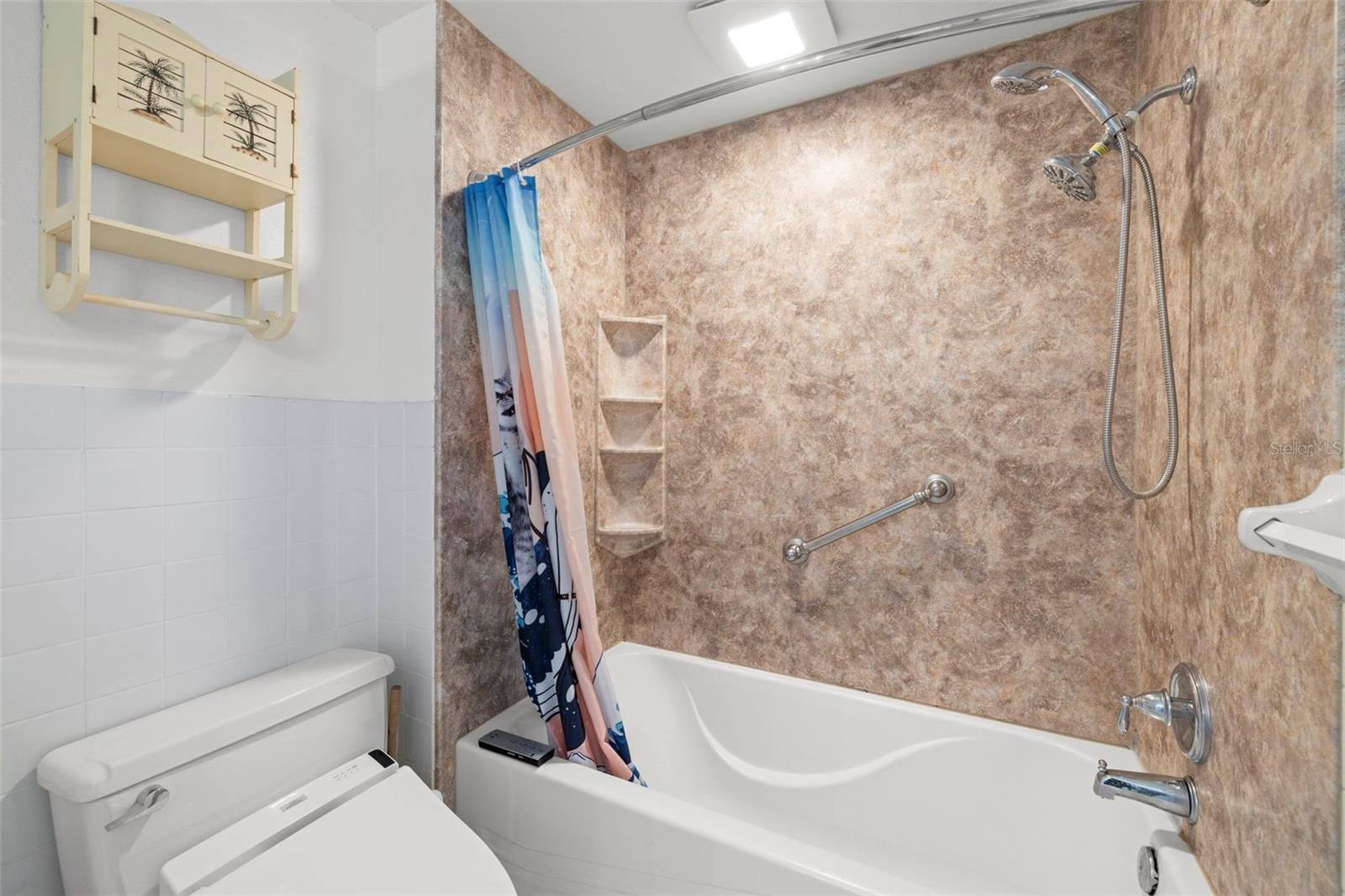Primary bathroom with tub/shower combination.