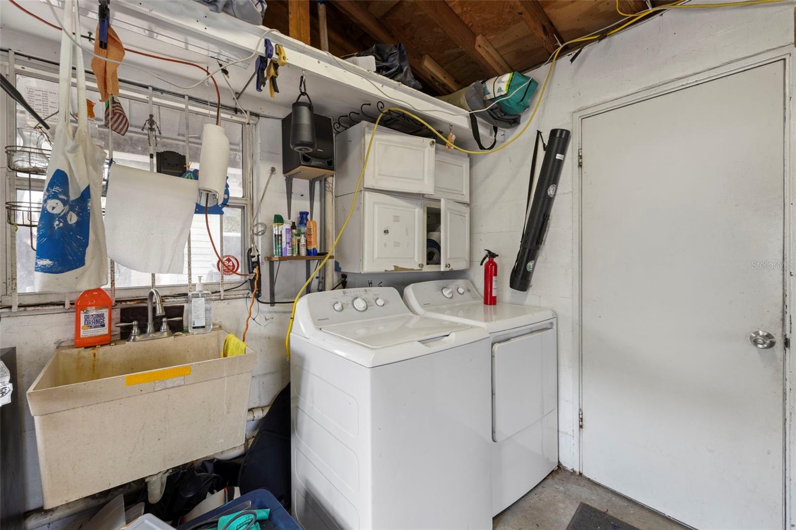 Laundry located in the spacious garage