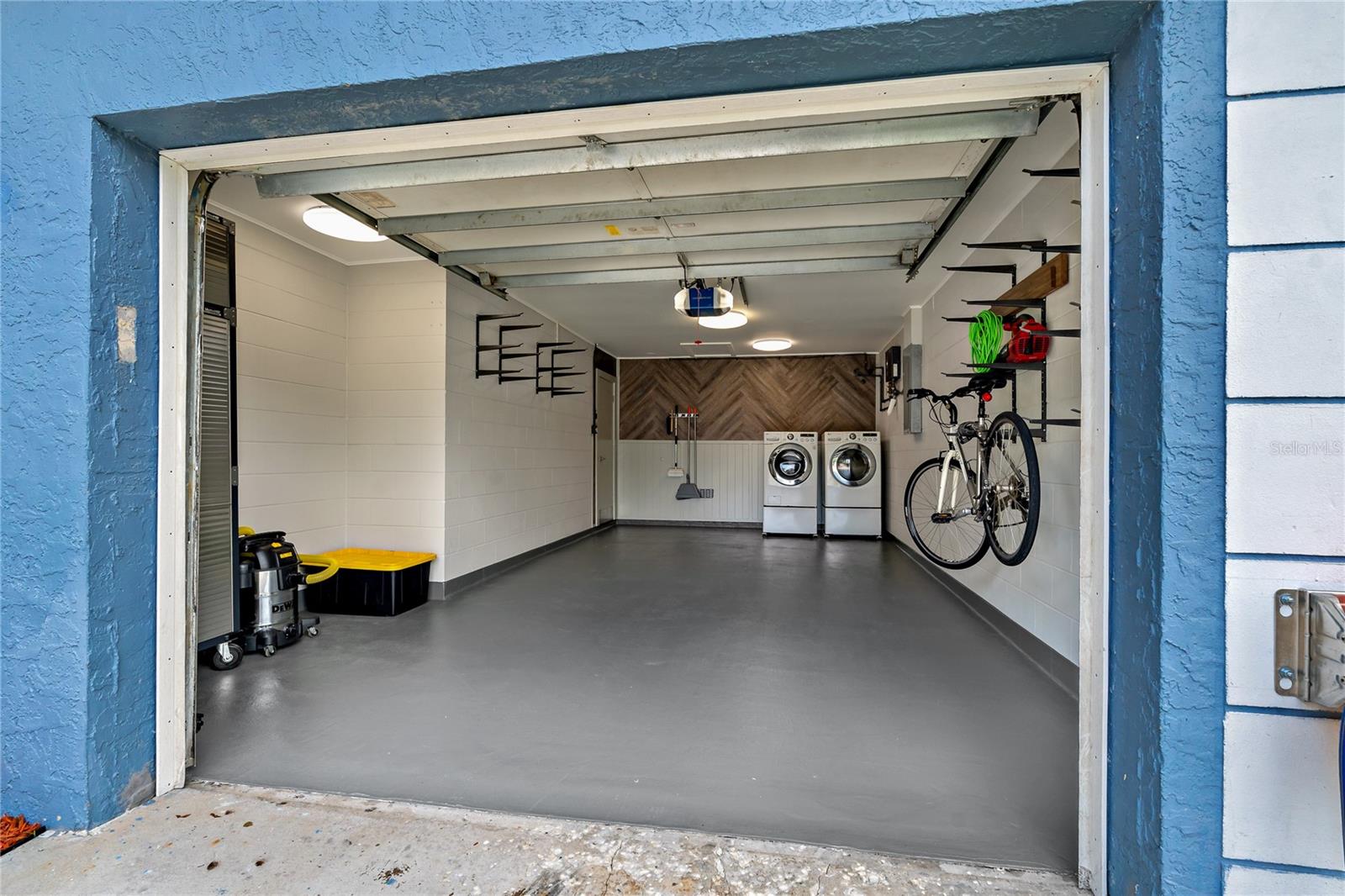 FRESHLY PAINTED GARAGE FLOOR WITH GREAT ORGANIZATIONAL SYSTEMS