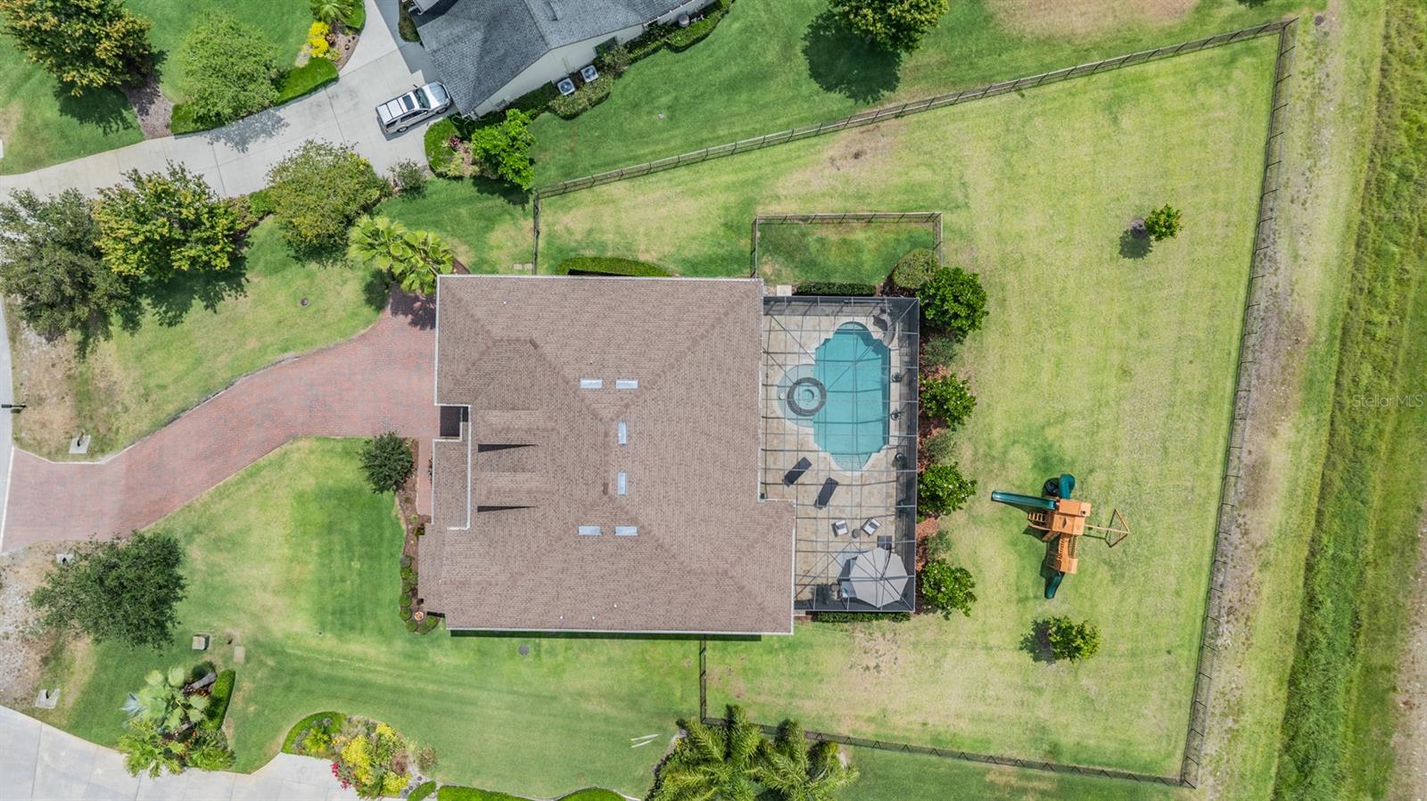 .64 acre lot, with aluminum fenced back yard, overlooking greenspace