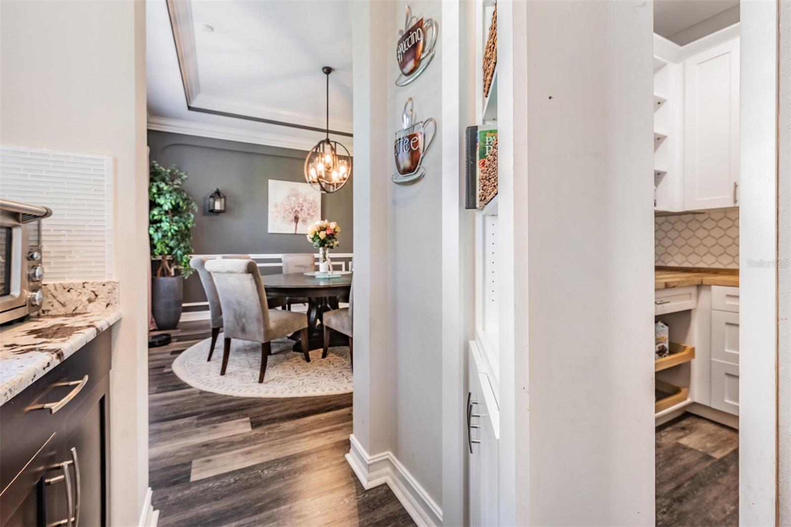 Custom hidden bookshelf door (right) to pantry