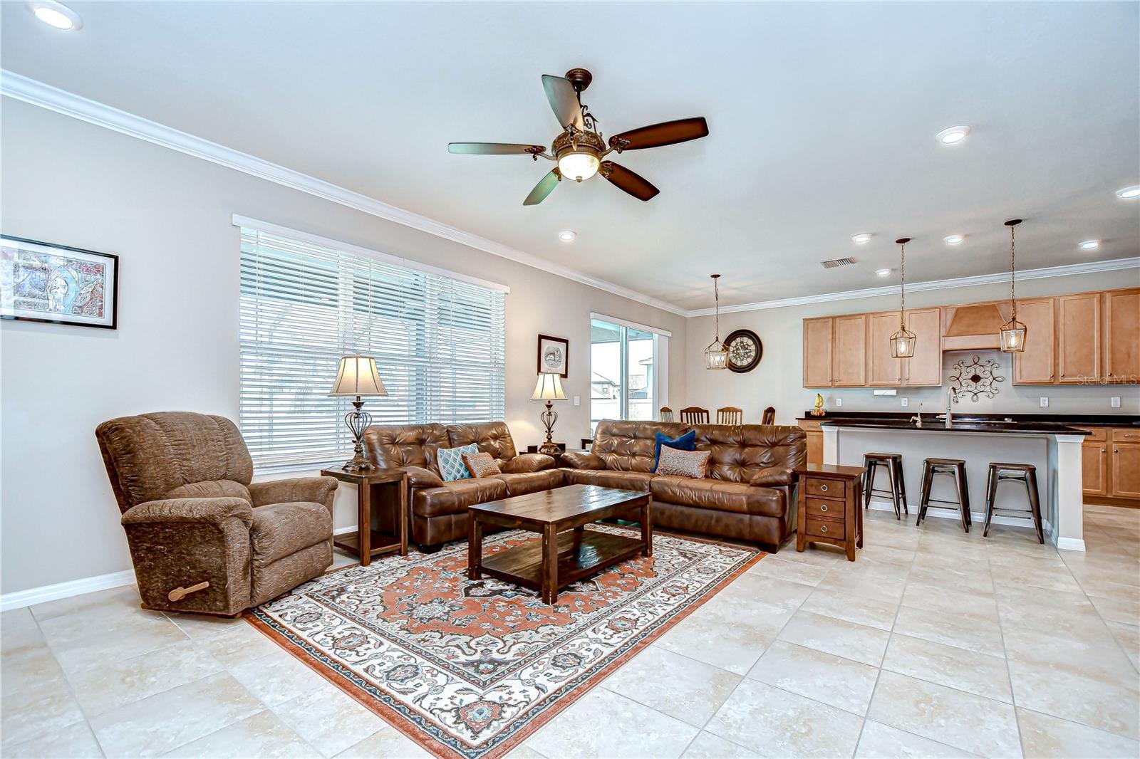 The great room offers expansive windows and sliding glass doors fill the space with natural light!
