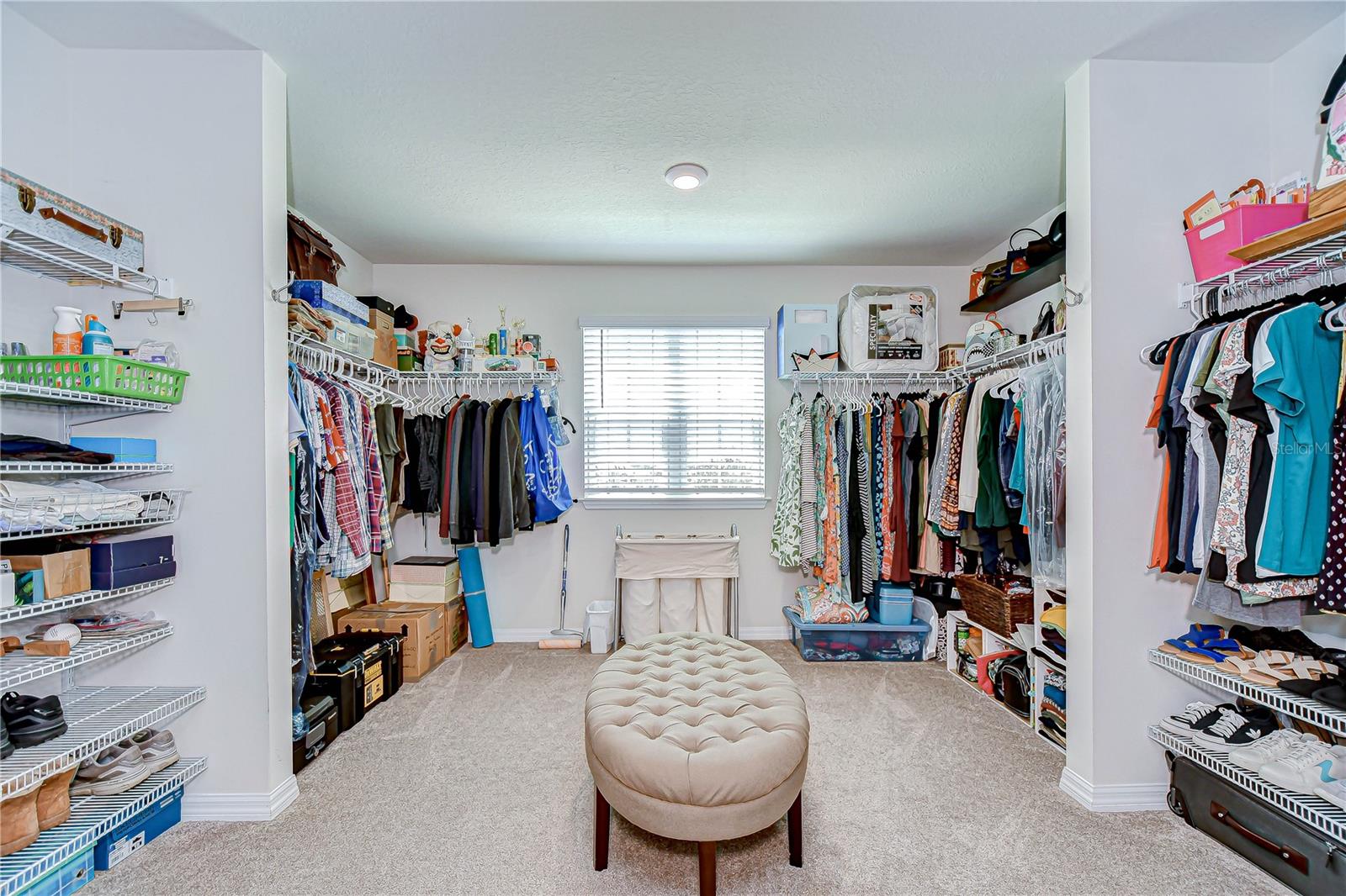 Live in luxury with the 15x15 primary walk-in closet!