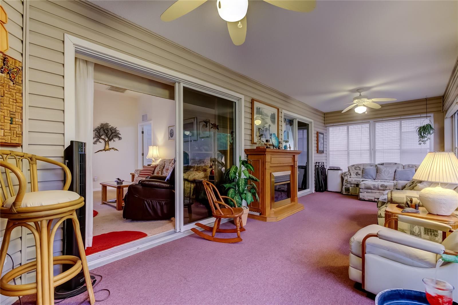 enclosed lanai with sliders to living room