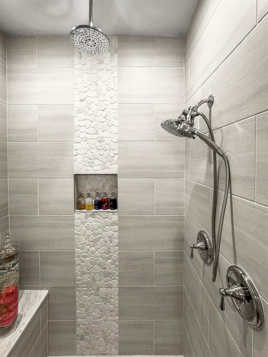 Upgraded tile work in multi-head primary shower