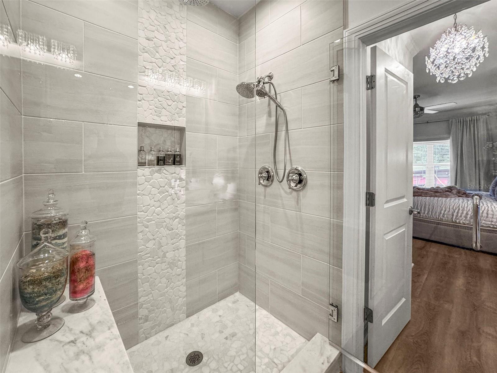 Frameless glass doors of primary shower