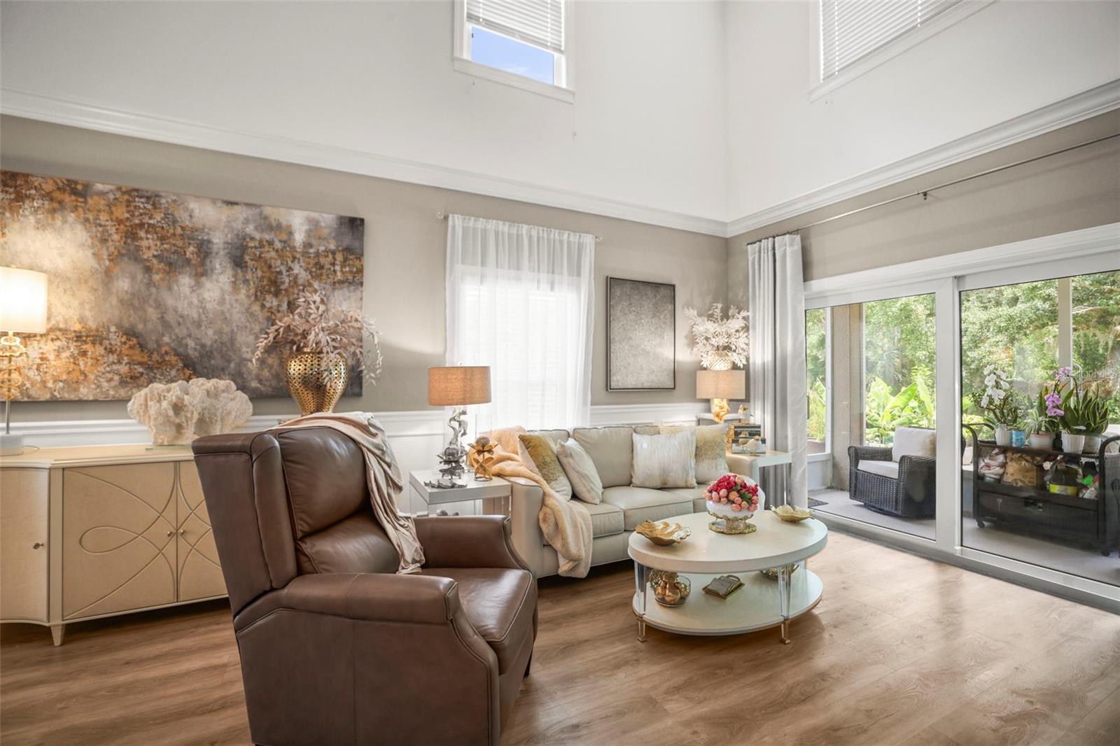 Living area with PGT slider to lanai and outdoor patio