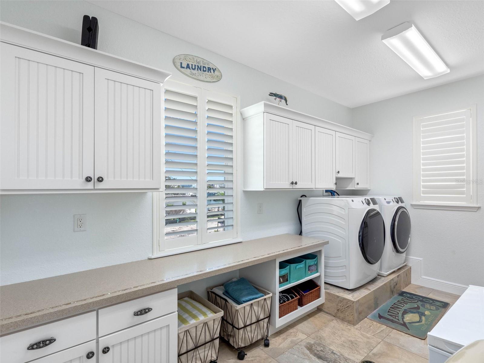 Interior laundry room with cabinets