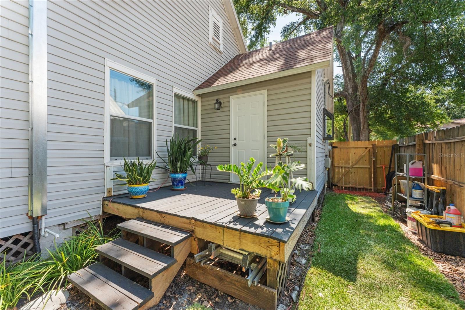 Back Patio with entrance to mudroom/laundry room