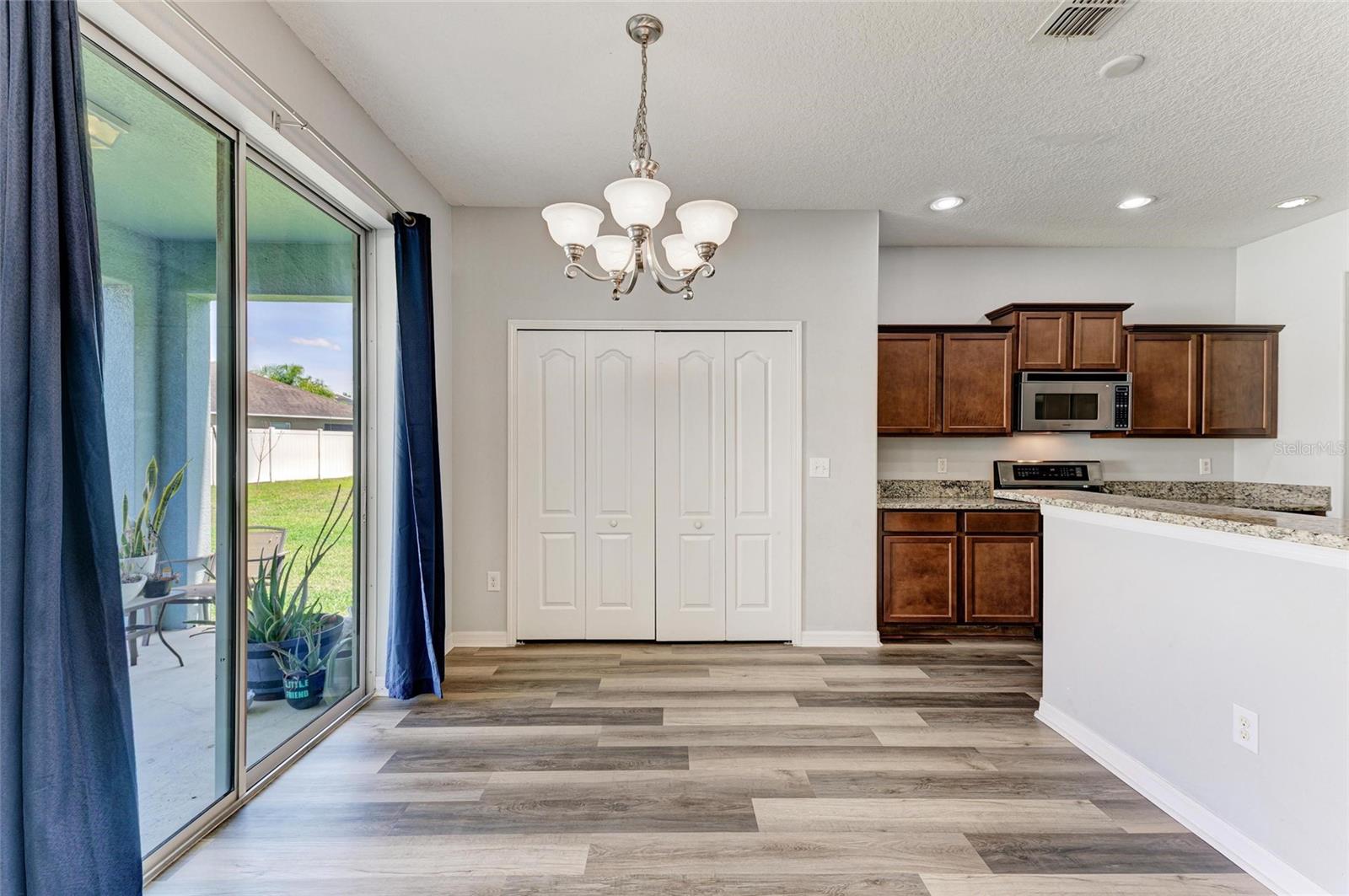 Kitchen, pantry closet and sliders to the lanai