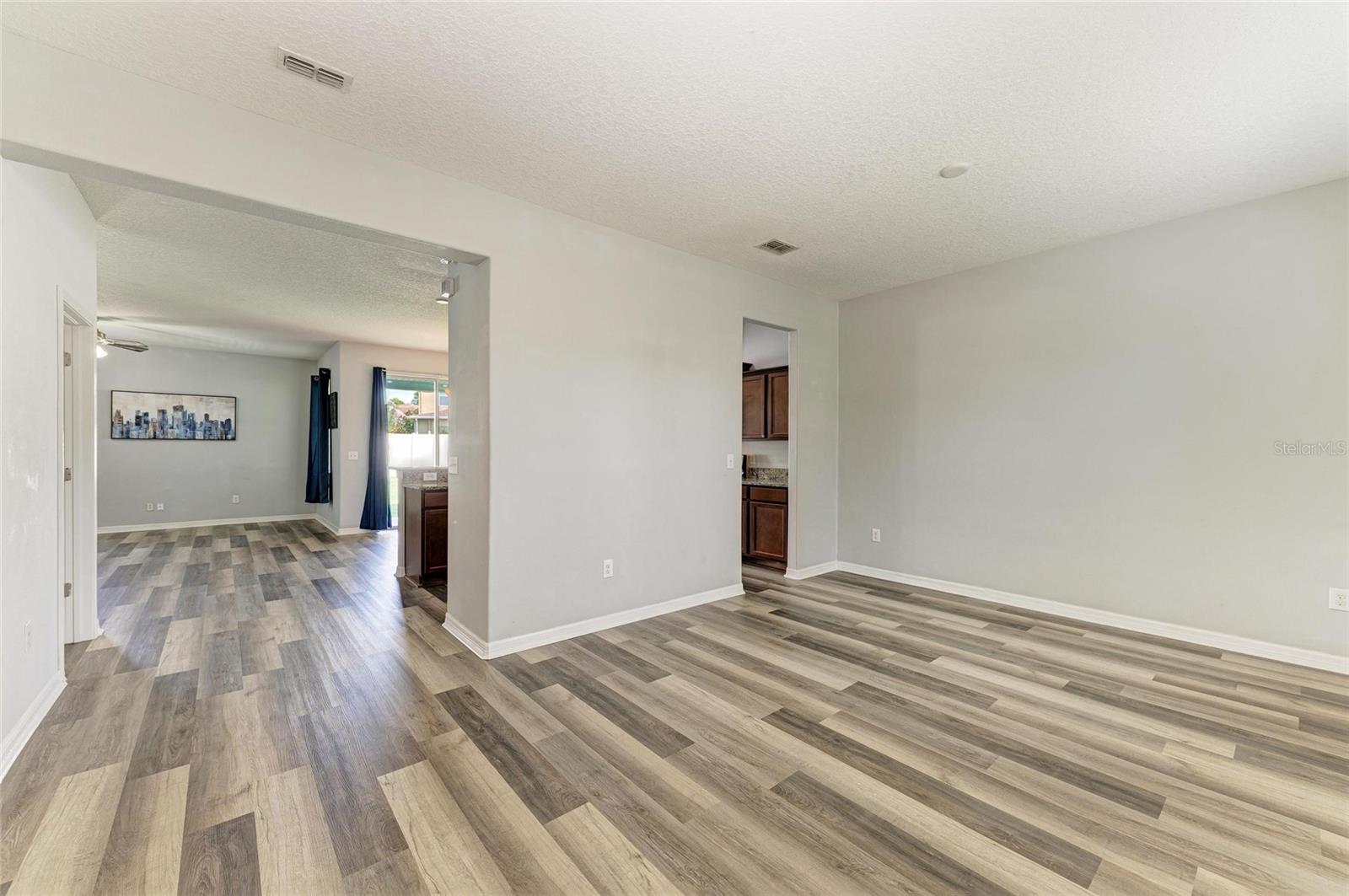 From front door.  Dining room to the right. Kitchen, breakfast nook and living room straight ahead.