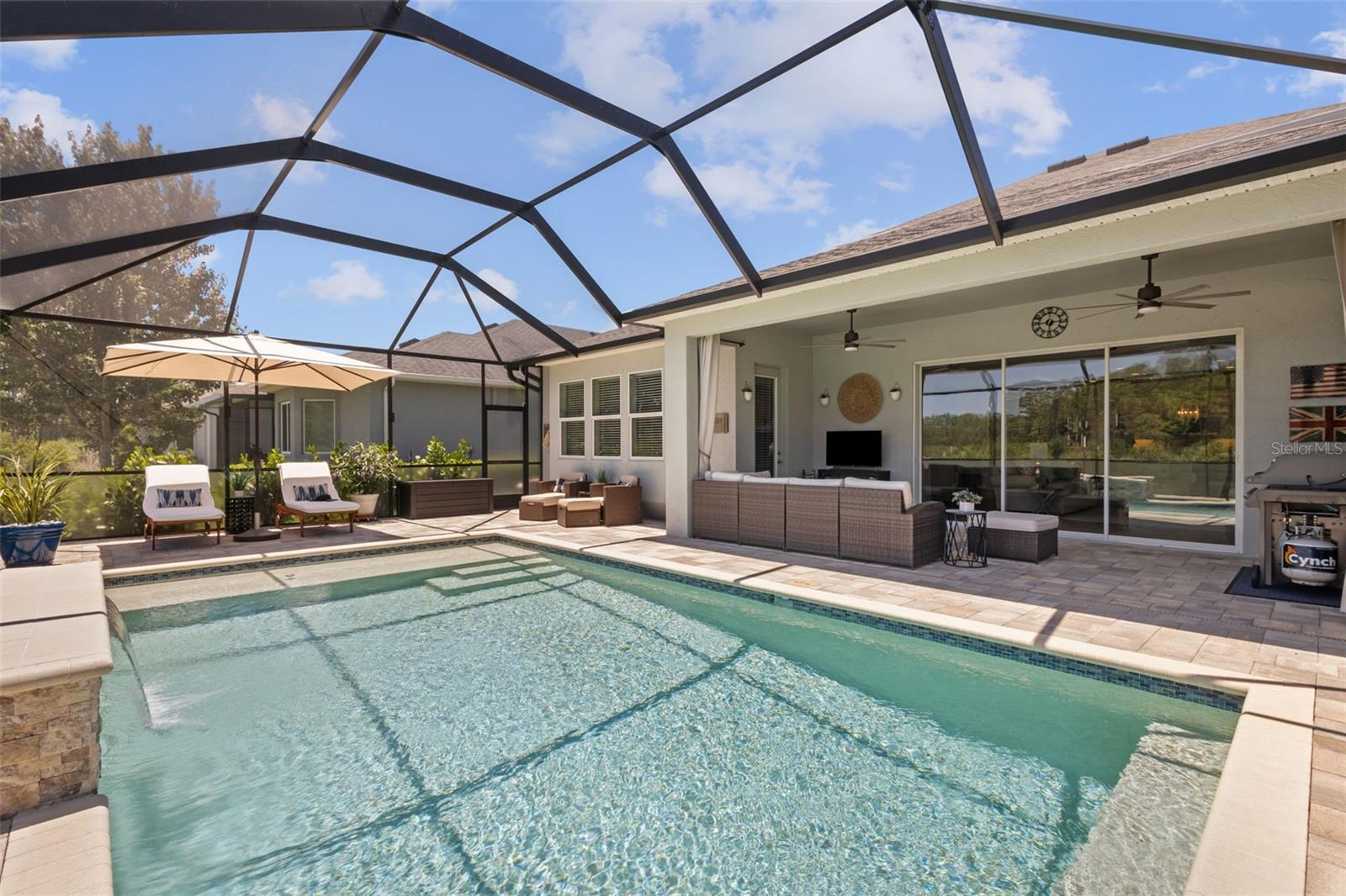 Pool fully caged in with expansive views