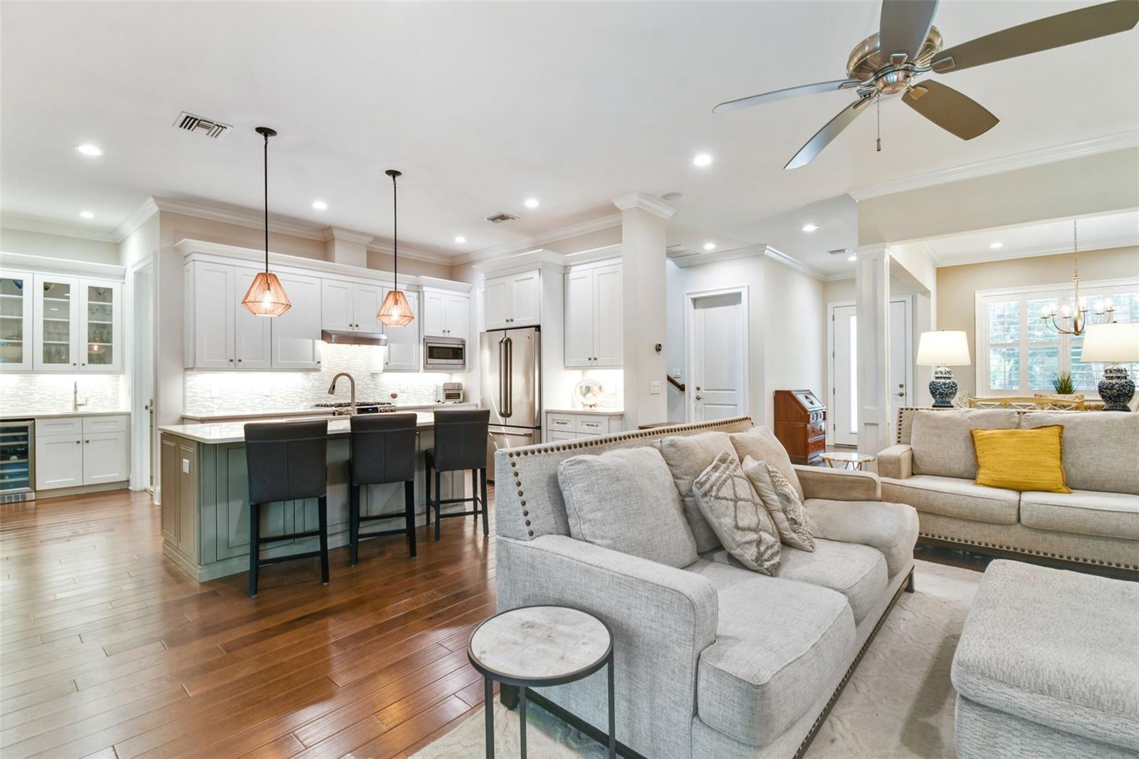 Open floor plan with quartz kitchen counters, seatings and living space