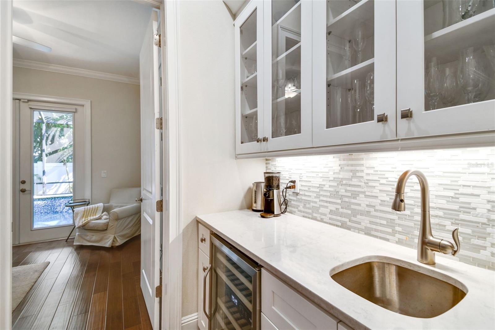 Wet bar and doorway to guest bedroom