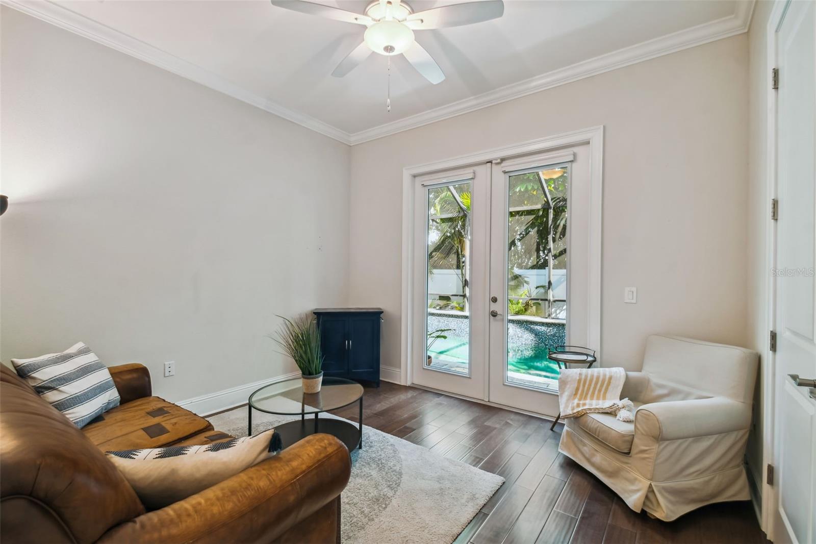 Guest bedroom with closet French doors to the pool and lanai