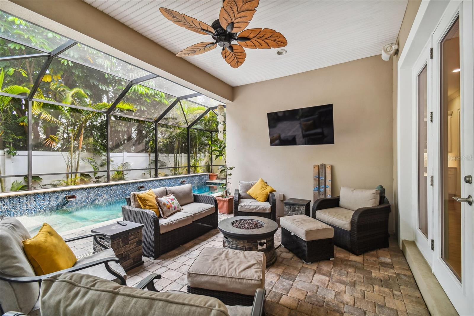 Large screened in lanai with built-in, dual zoned speaker system and fan