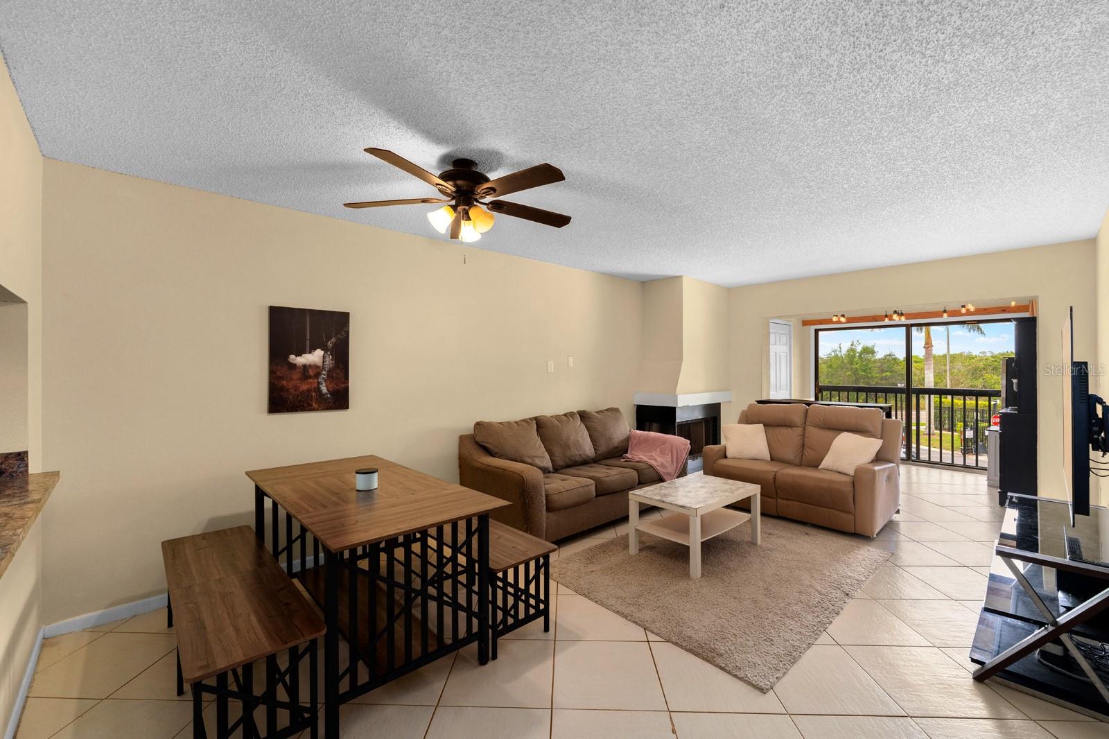 Large living room with neutral ceramic tile