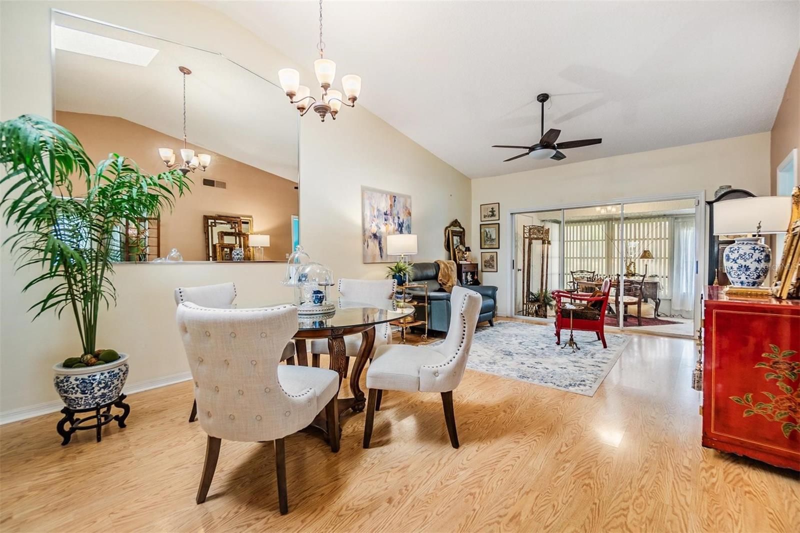 Open concept dining area with high ceilings.