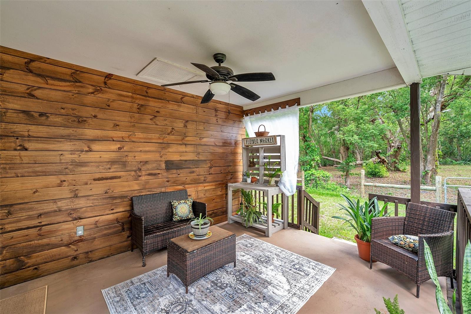 Custom wood back deck wall w/power outlets.