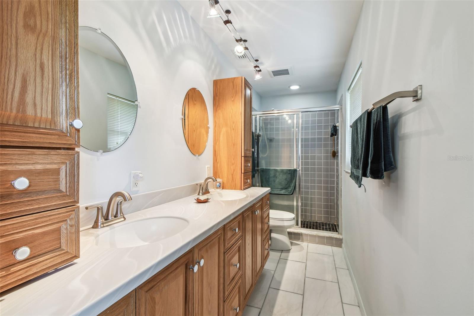 Primary Bathroom w/twin vanities & walk-in shower