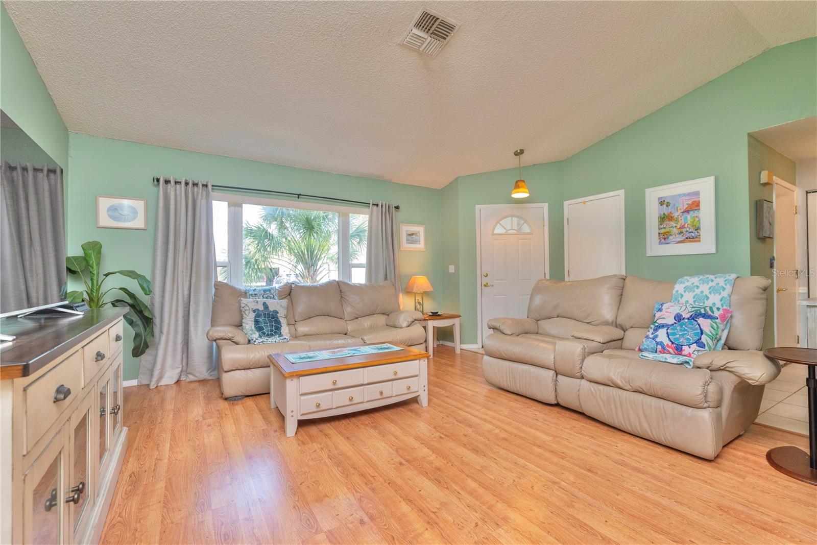 Living room with cathedral ceilings.