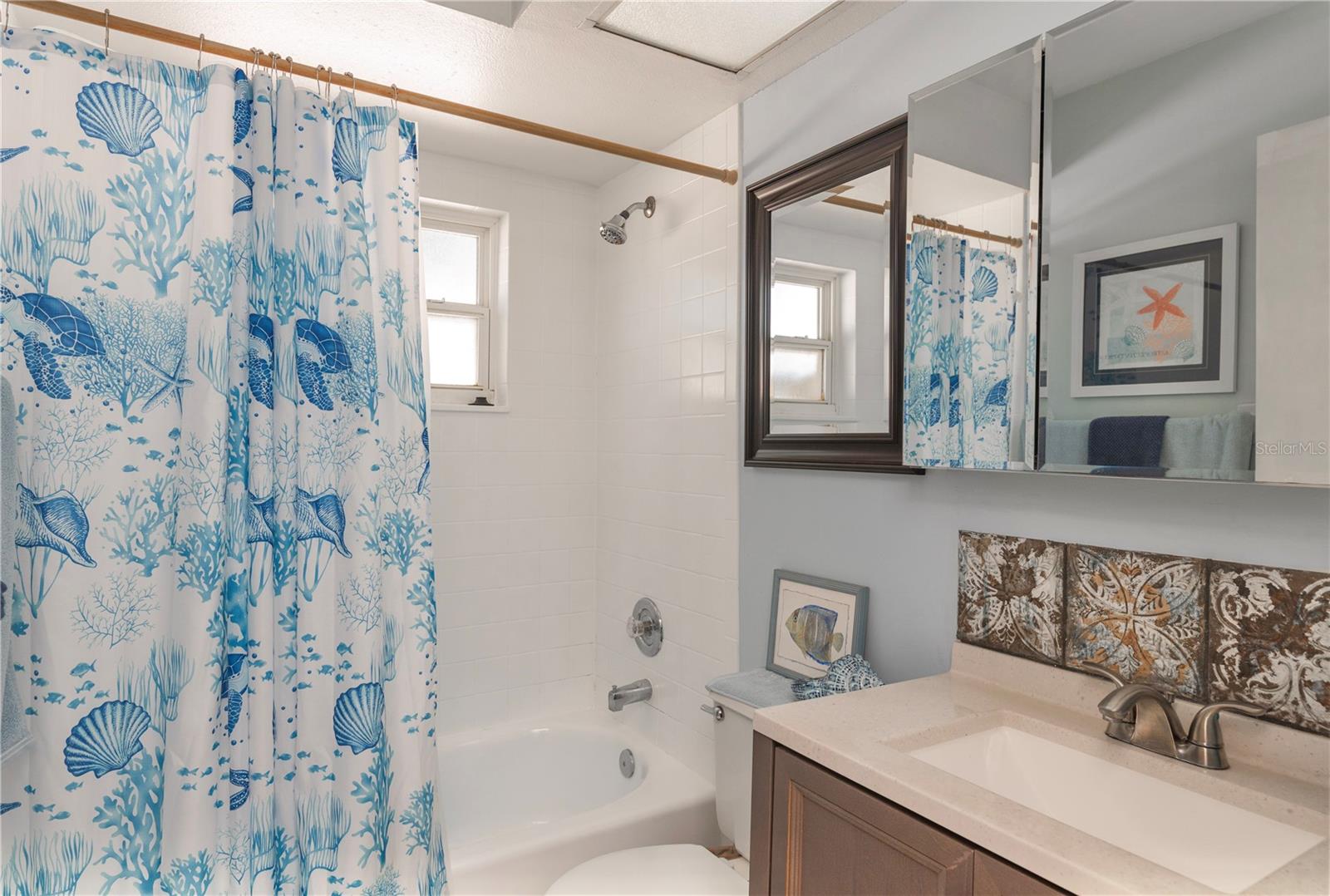 Guest bathroom with tub.