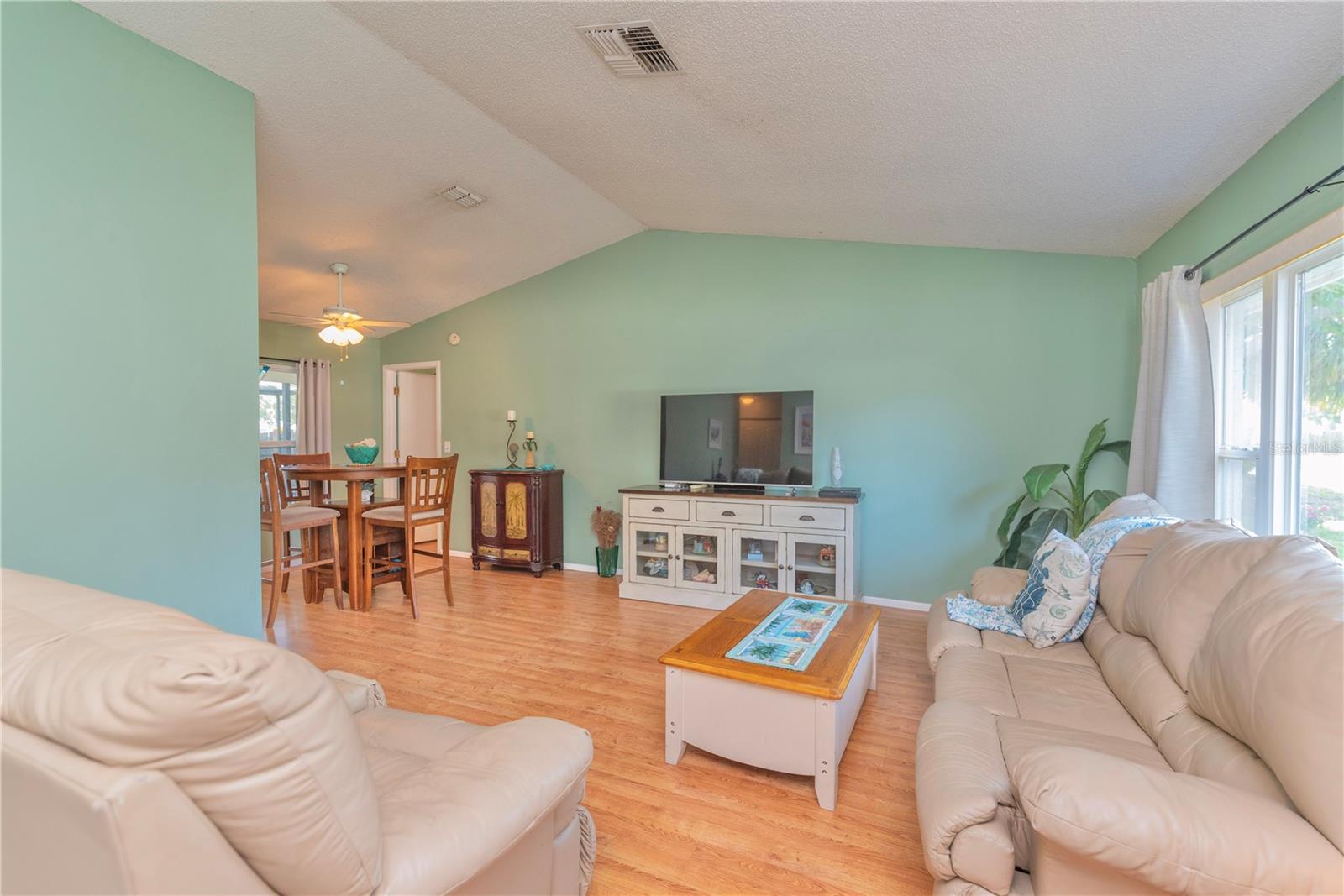 Living room with cathedral ceilings.