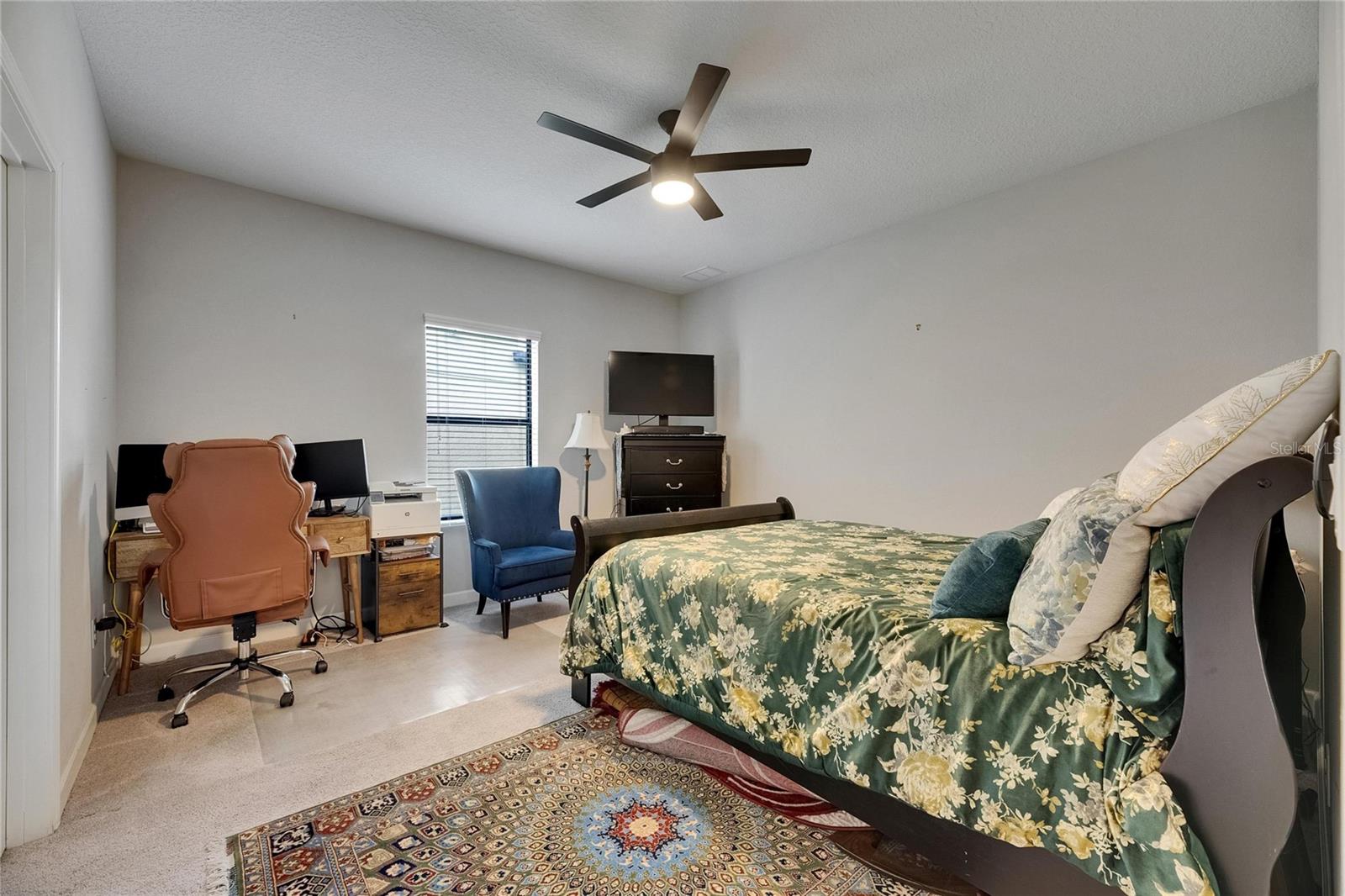A versatile first-floor den, office, or bedroom offers flexibility and is conveniently located next to an adjoining hall bath.