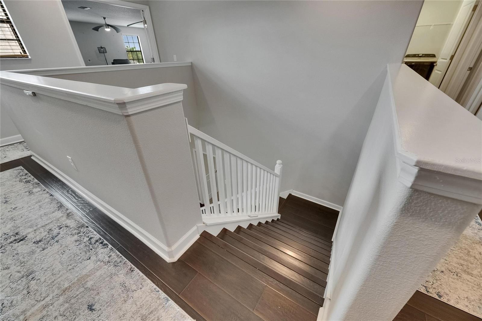 The staircase to the second-floor features integrated LED lighting, providing both enhanced safety and stylish ambiance.