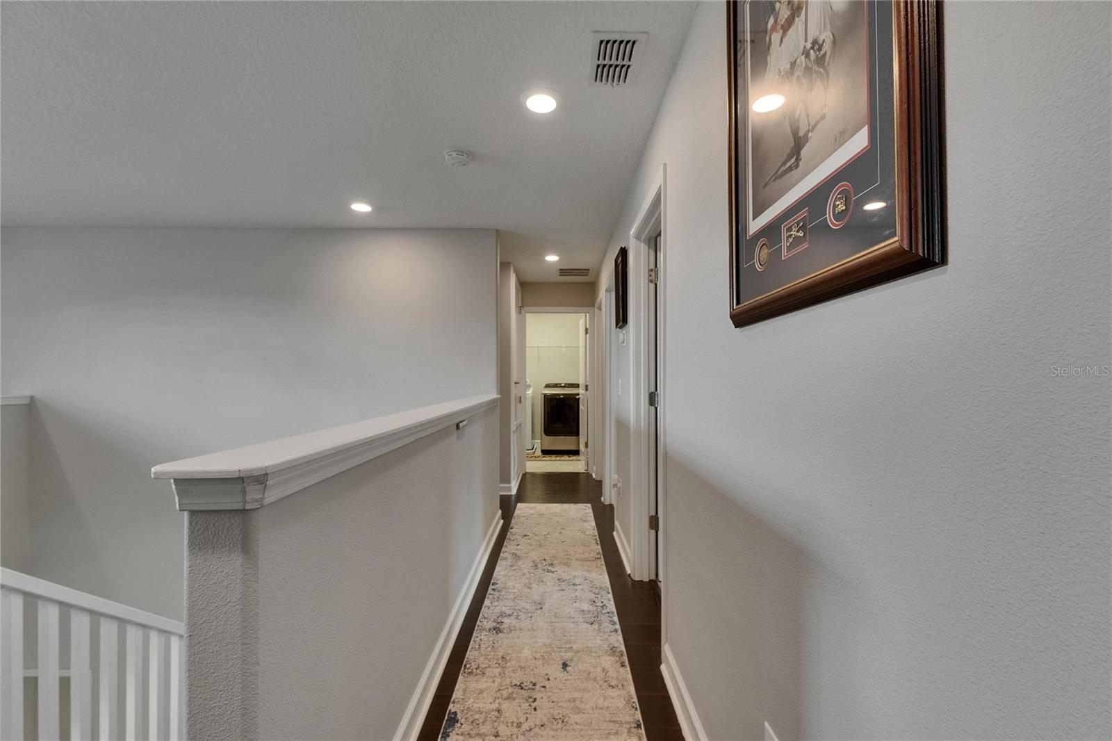 Hallway to secondary rooms and laundry