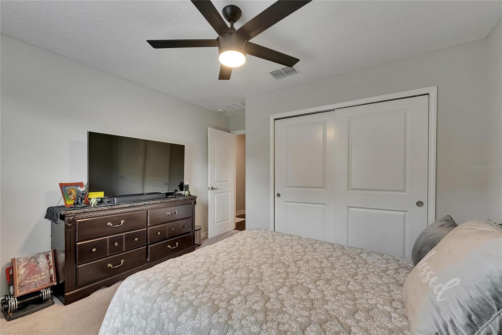 This secondary bedroom offers ample space