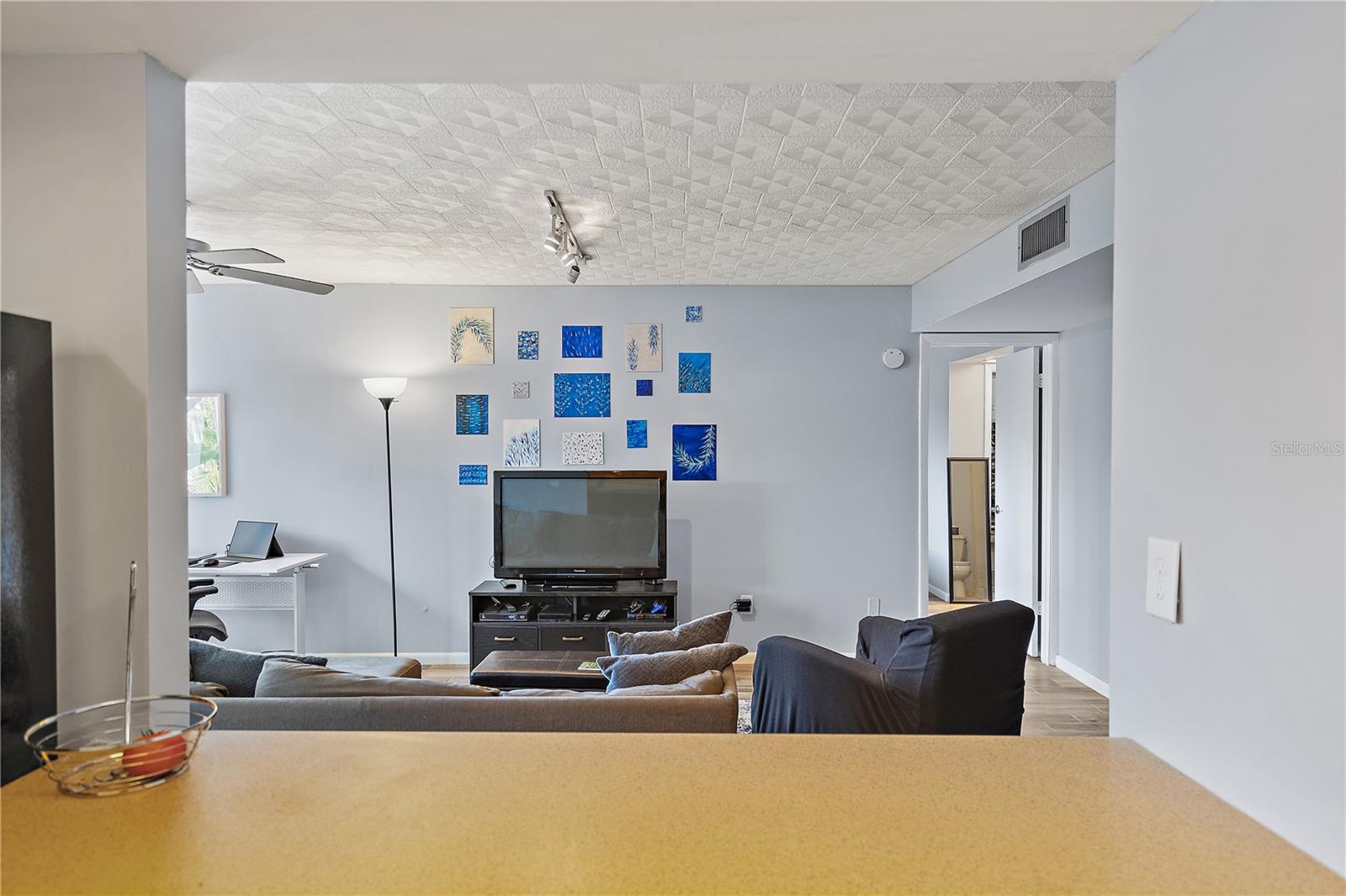 Watch TV and interact with guests while you cook